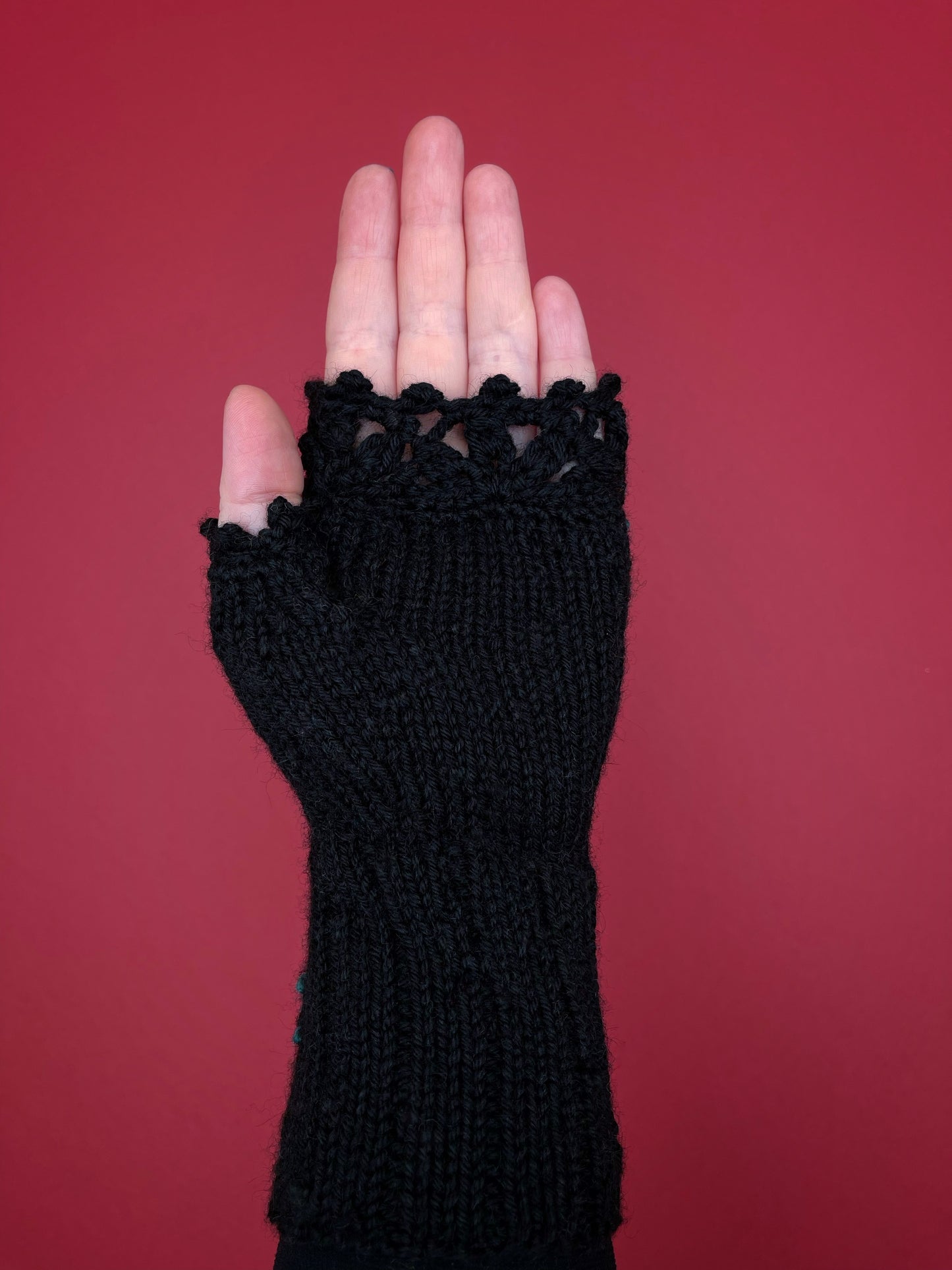 Black hand knitted gloves with embroidered red roses and bees
