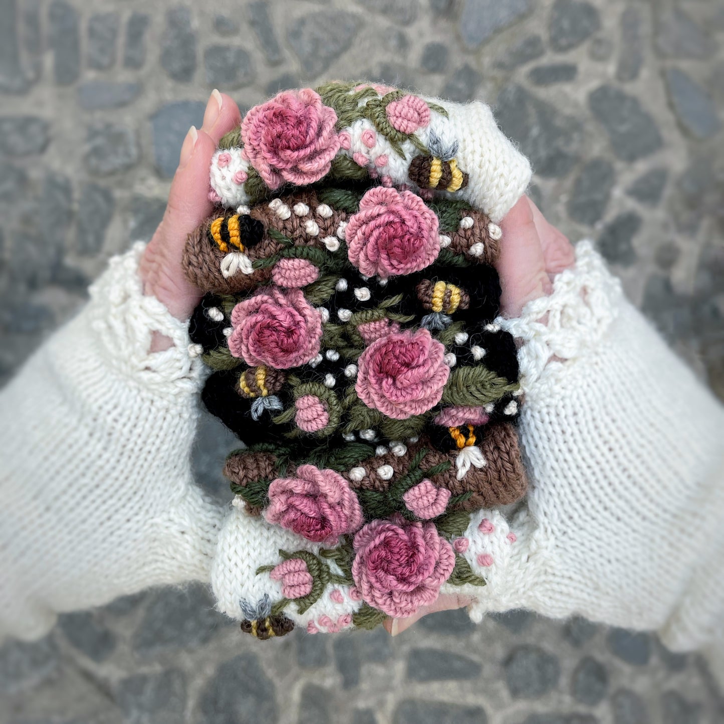 Black gloves with pink roses and bees