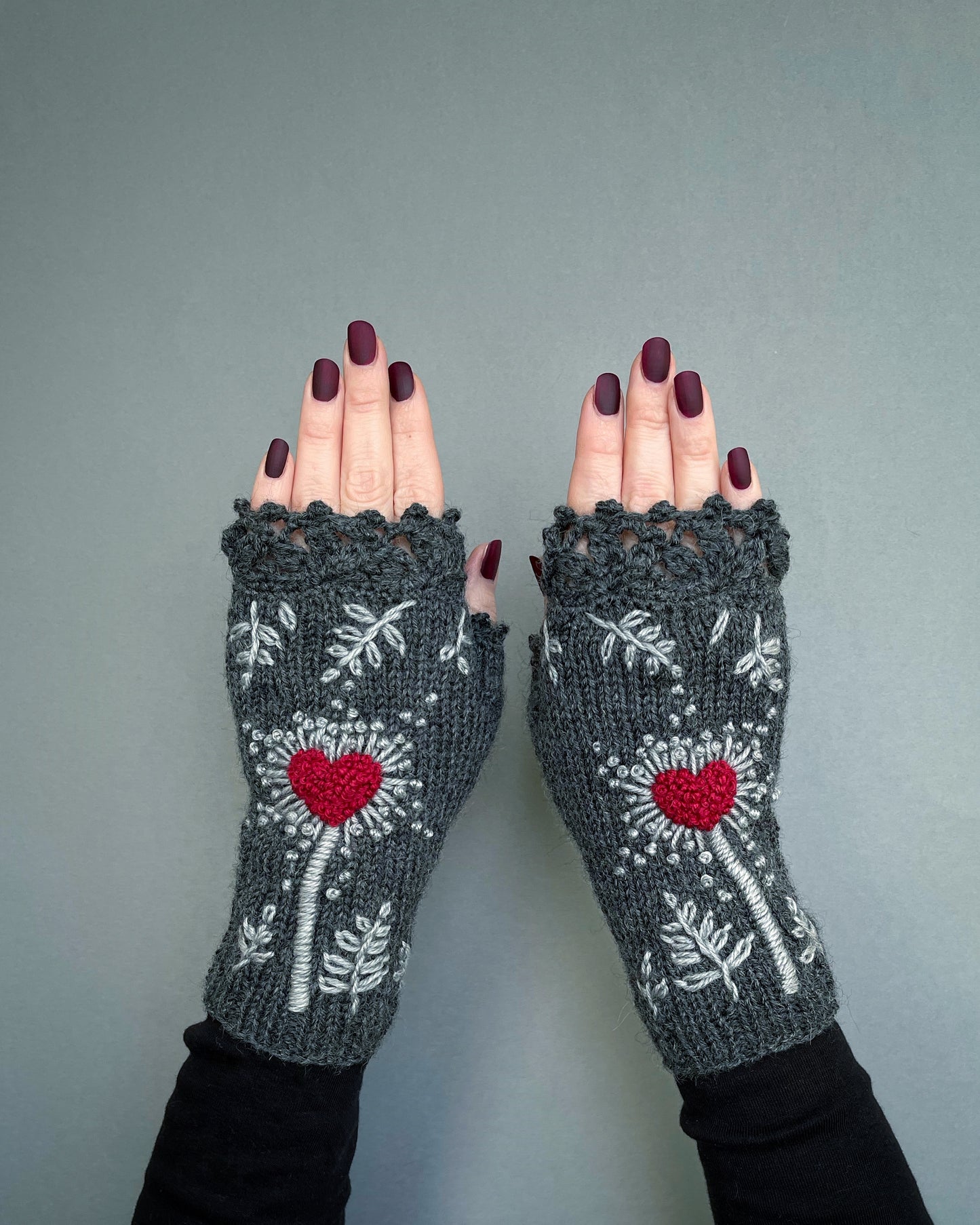 Gray gloves with hearts and leaves