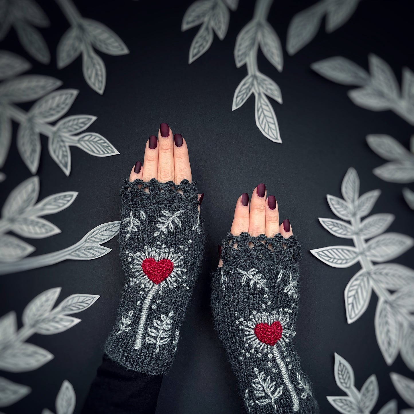 Gray gloves with hearts and leaves