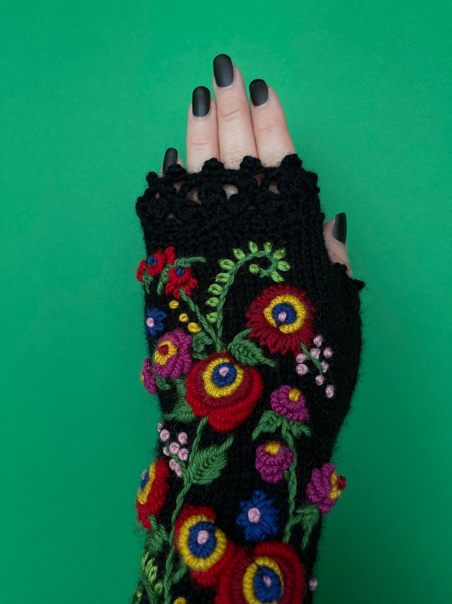 Black long gloves with brightly colored floral ornament