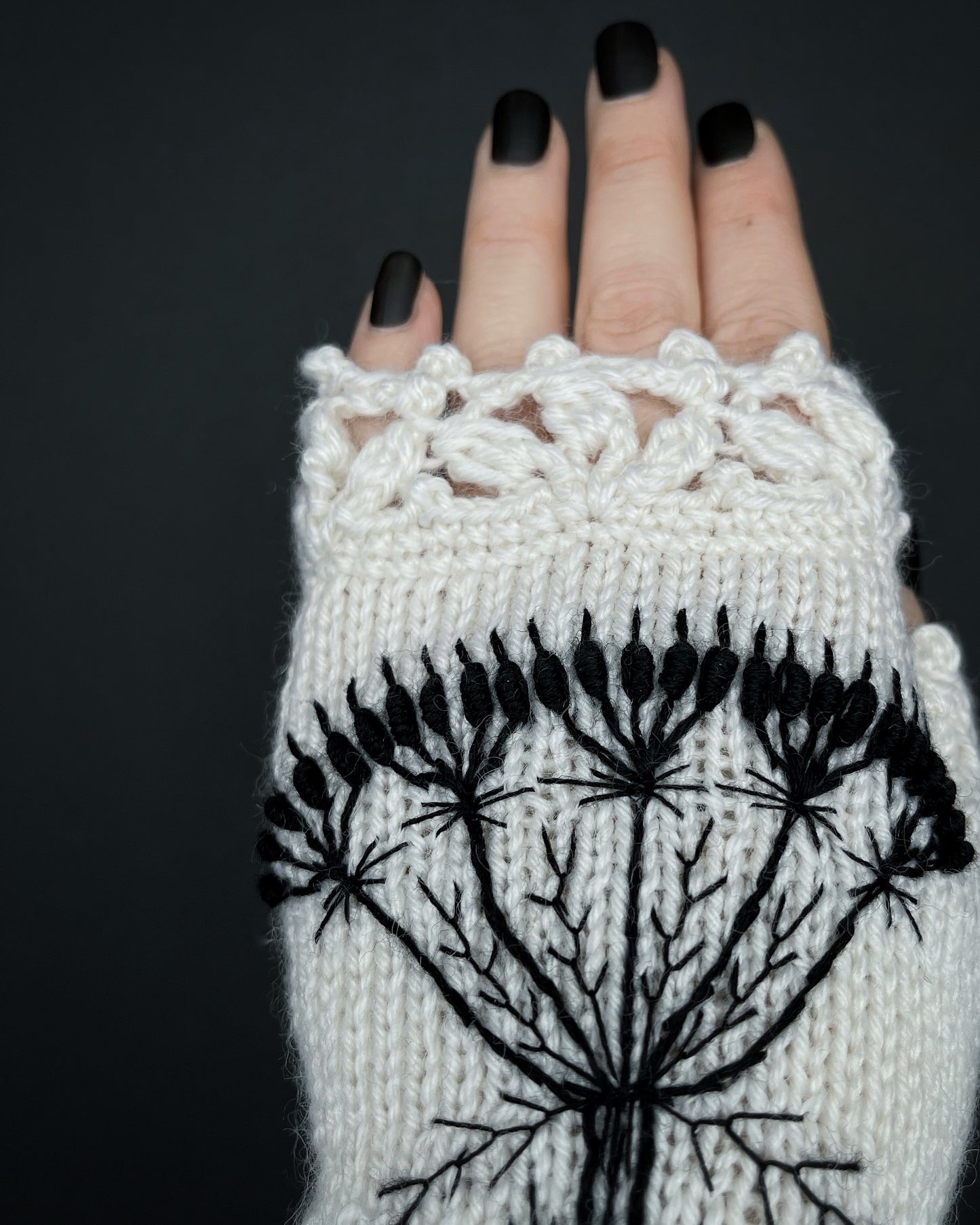 White gloves with embroidered wild flower