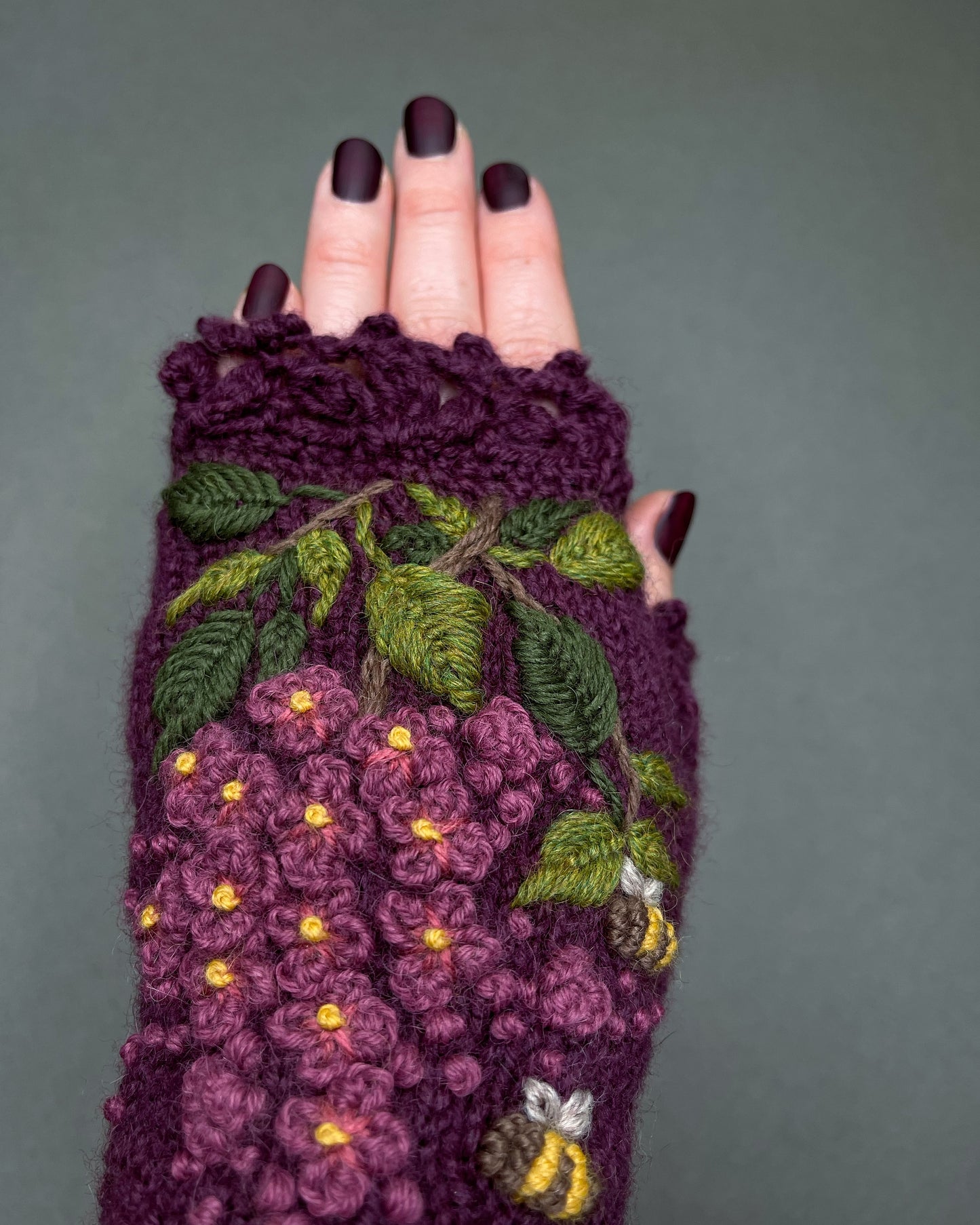 Purple gloves with lilacs and bees