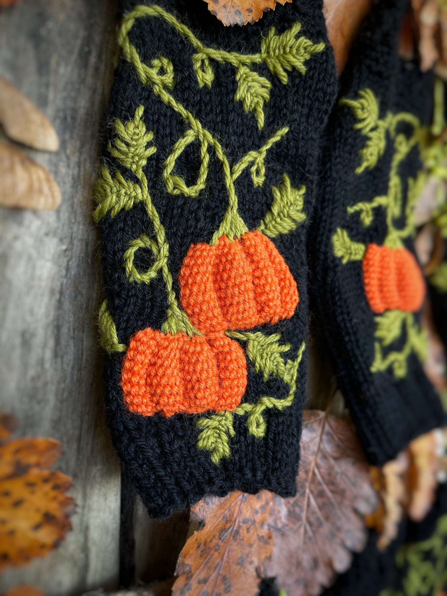 Black fingerless gloves with embroidered pumpkins