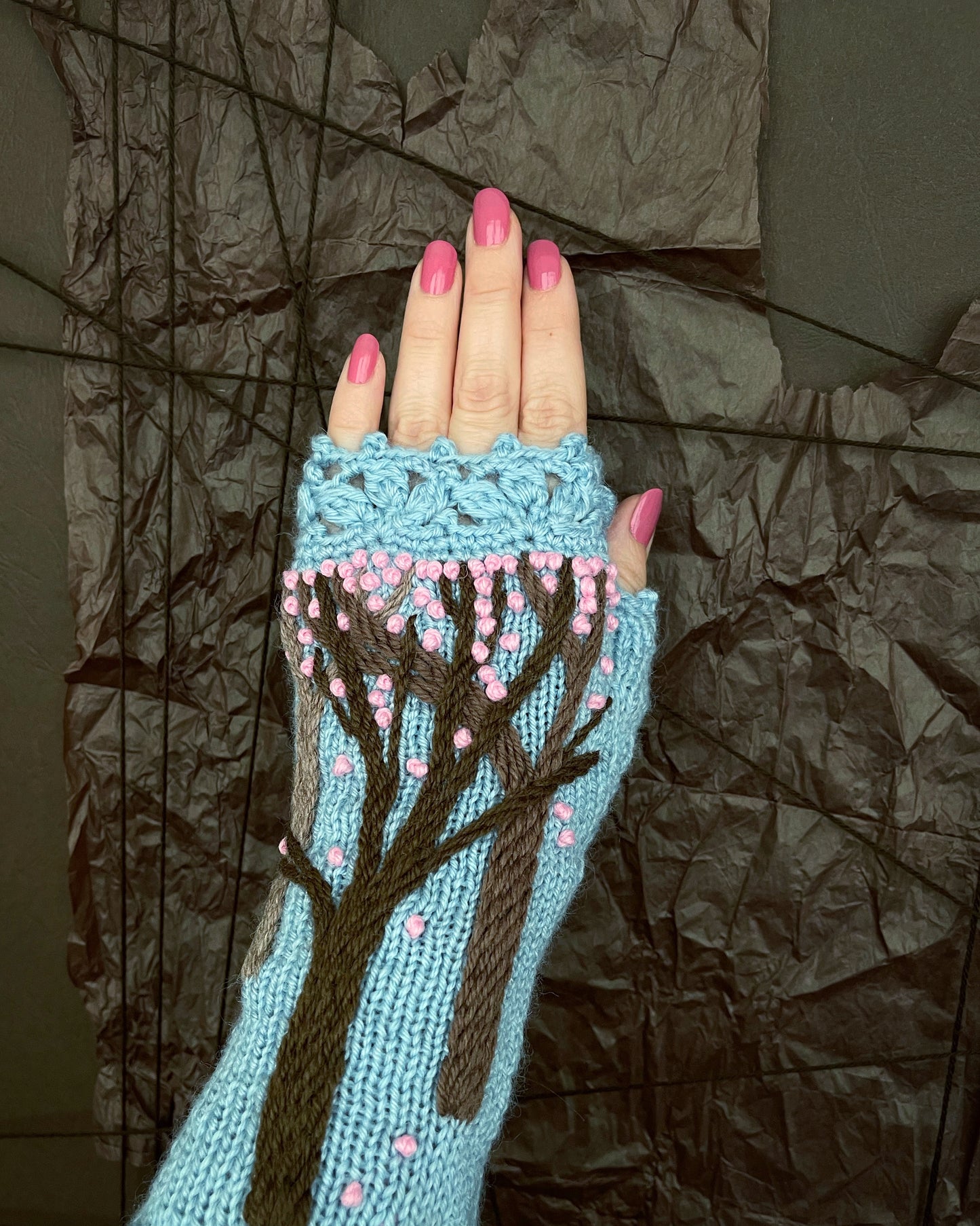 Light blue gloves with spring sakura trees