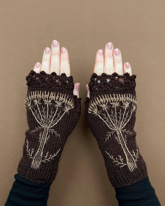 Hand knitted brown gloves with wild flowers