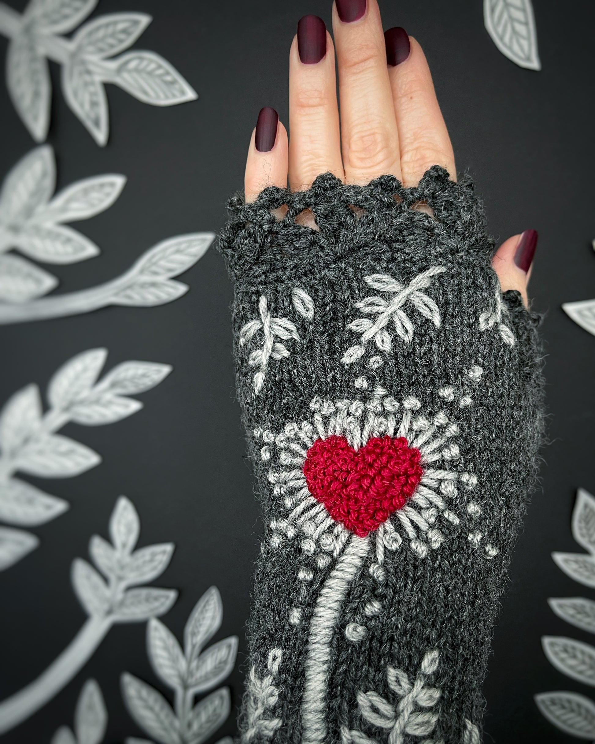 Dark gray embroidered gloves with red heart and leaves