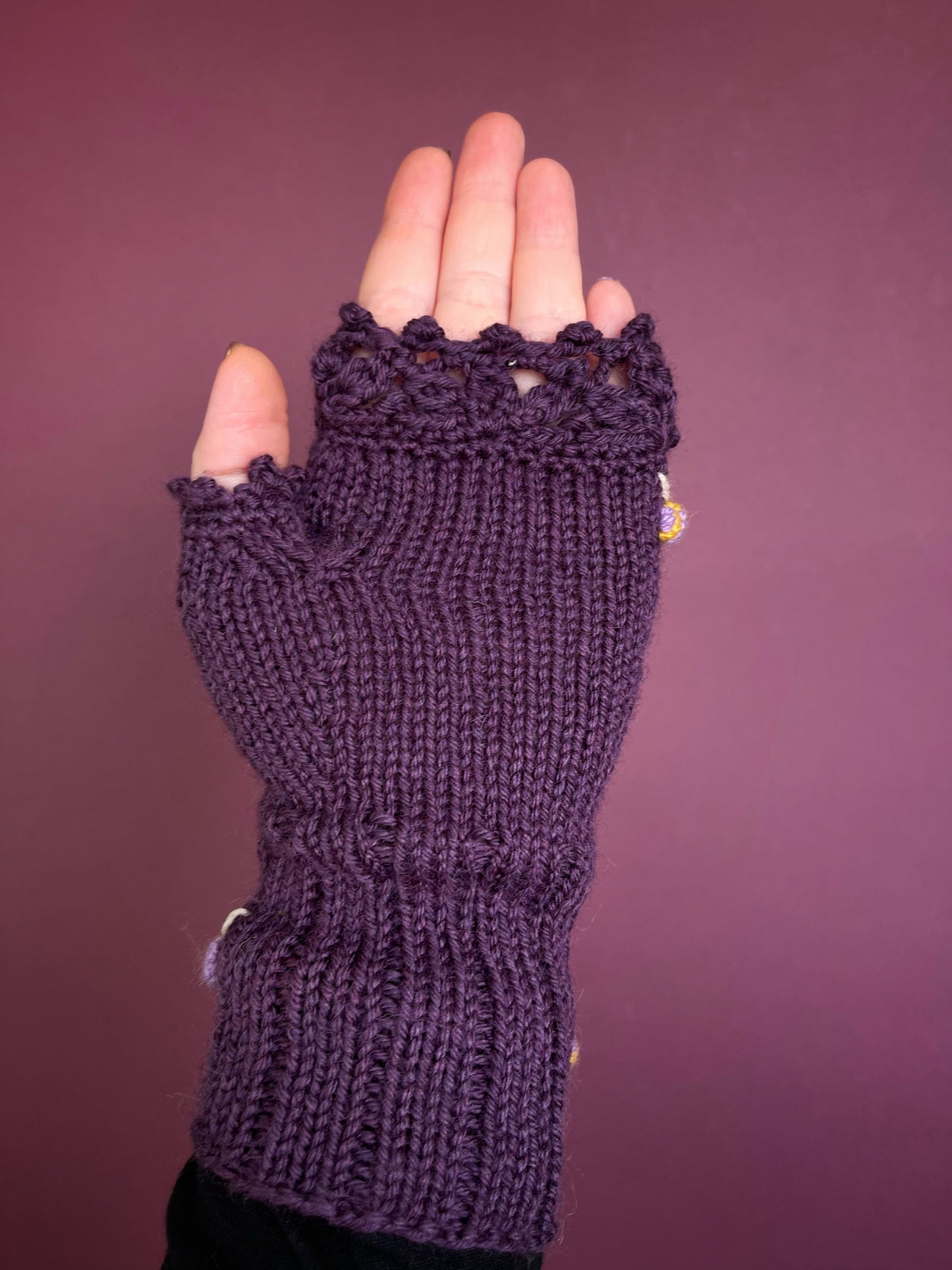 Hand knitted violet fingerless gloves with lilac bees embroidery