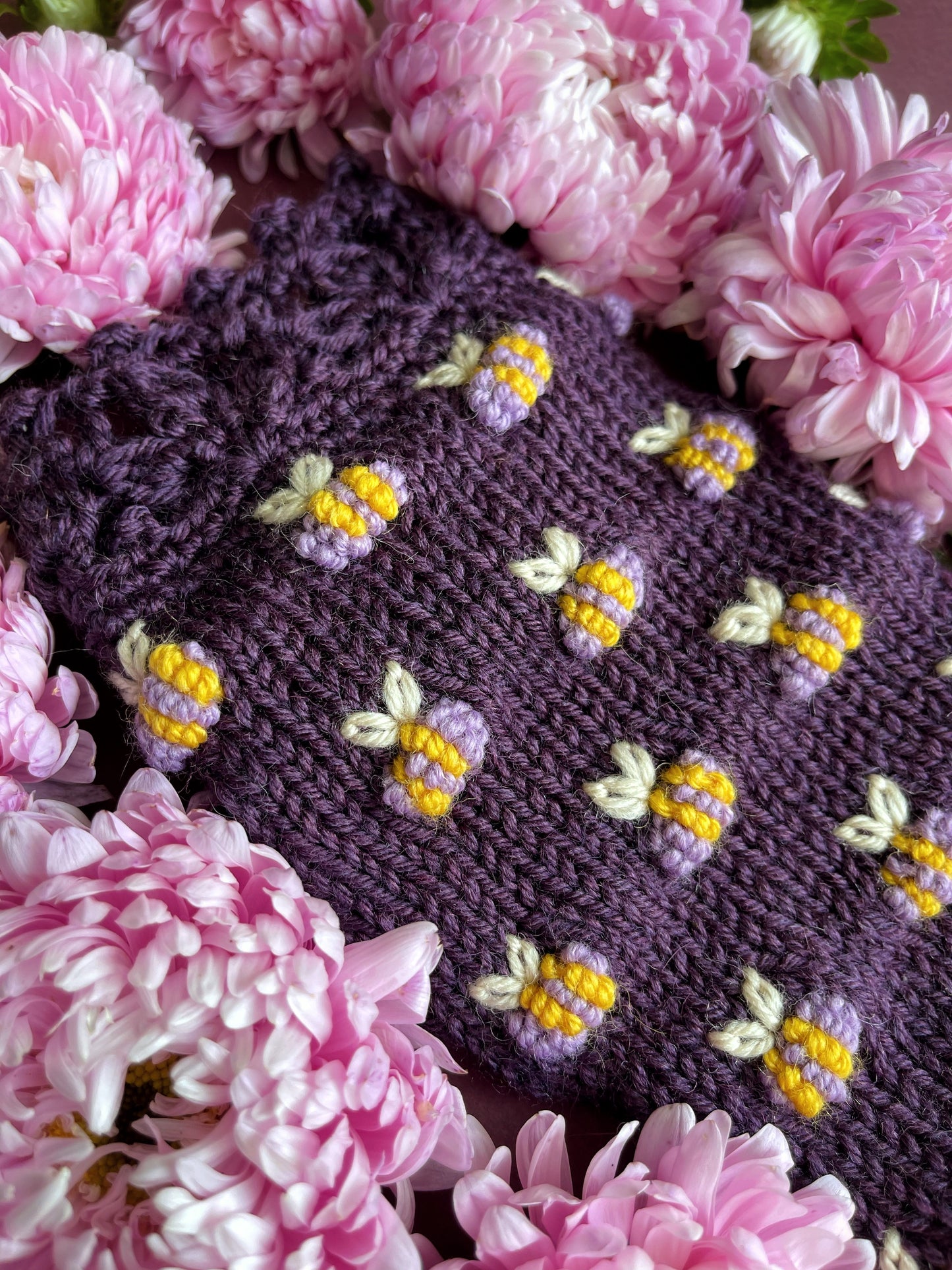 Hand knitted violet fingerless gloves with lilac bees embroidery