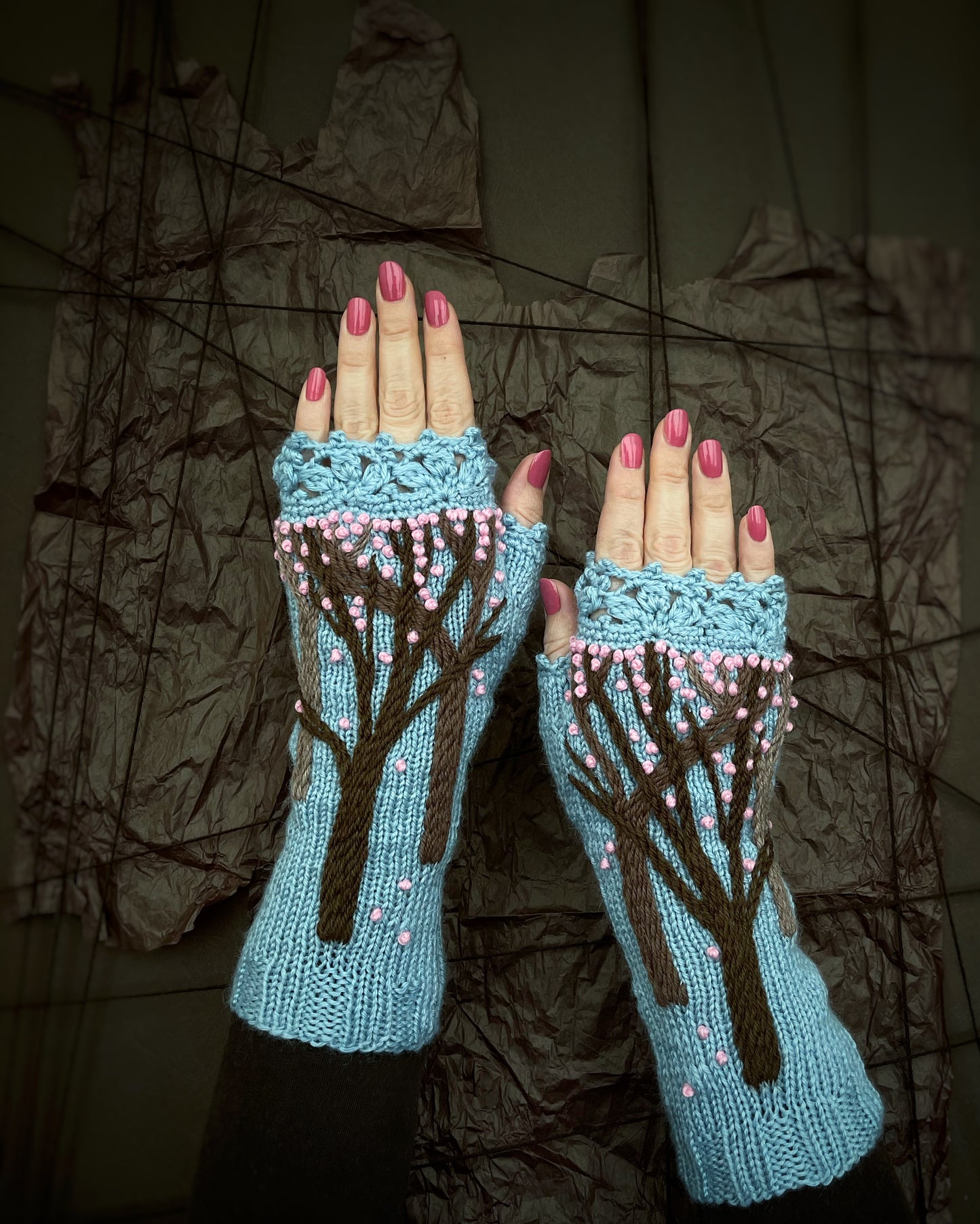 Light blue gloves with spring trees and pink sakura flowers