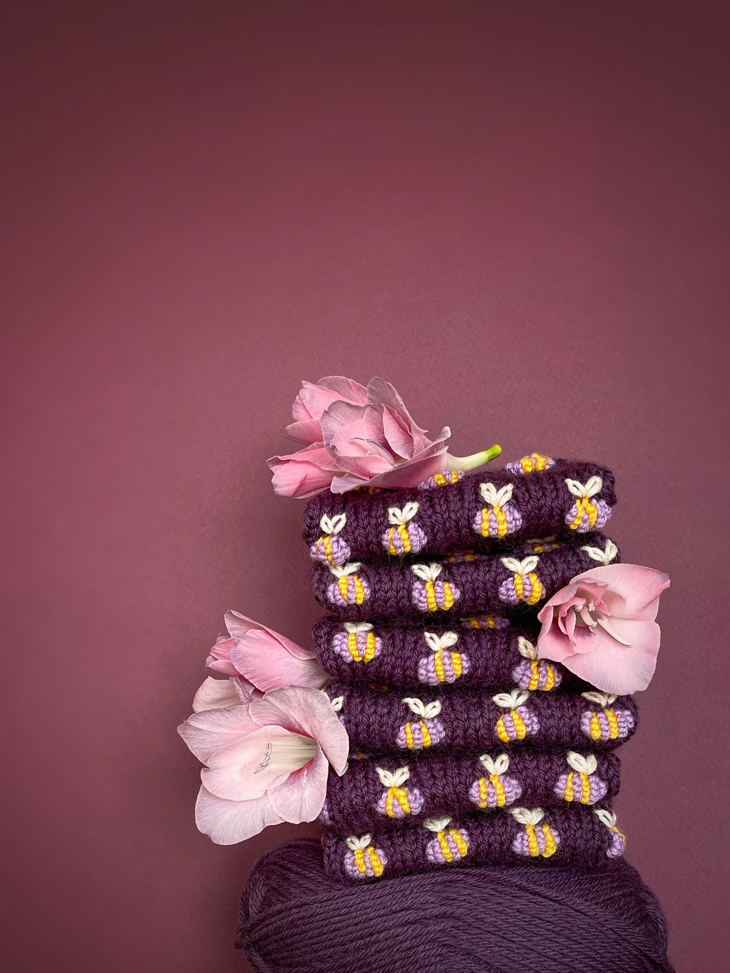 Hand knitted violet fingerless gloves with lilac bees embroidery