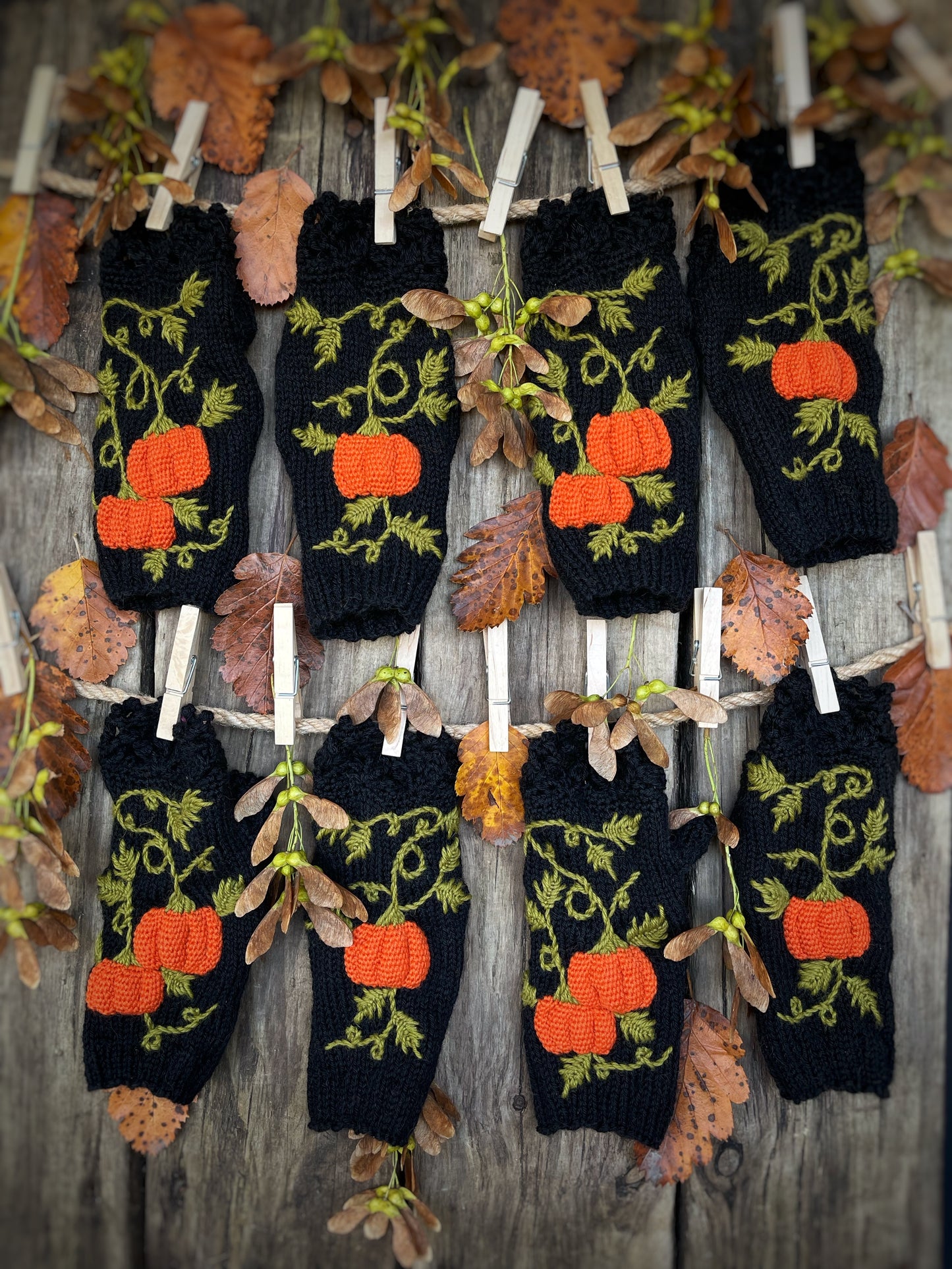 Black fingerless gloves with embroidered pumpkins