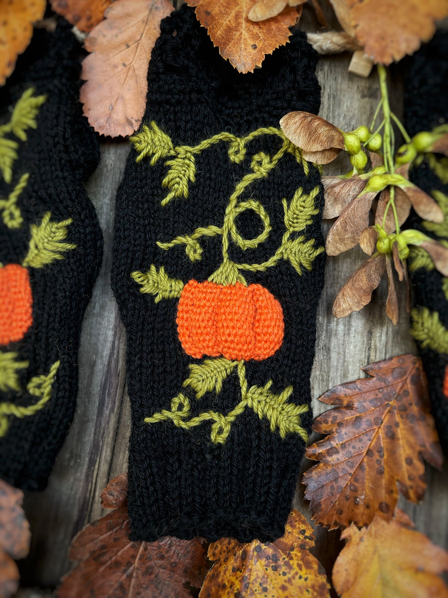 Black fingerless gloves with embroidered pumpkins