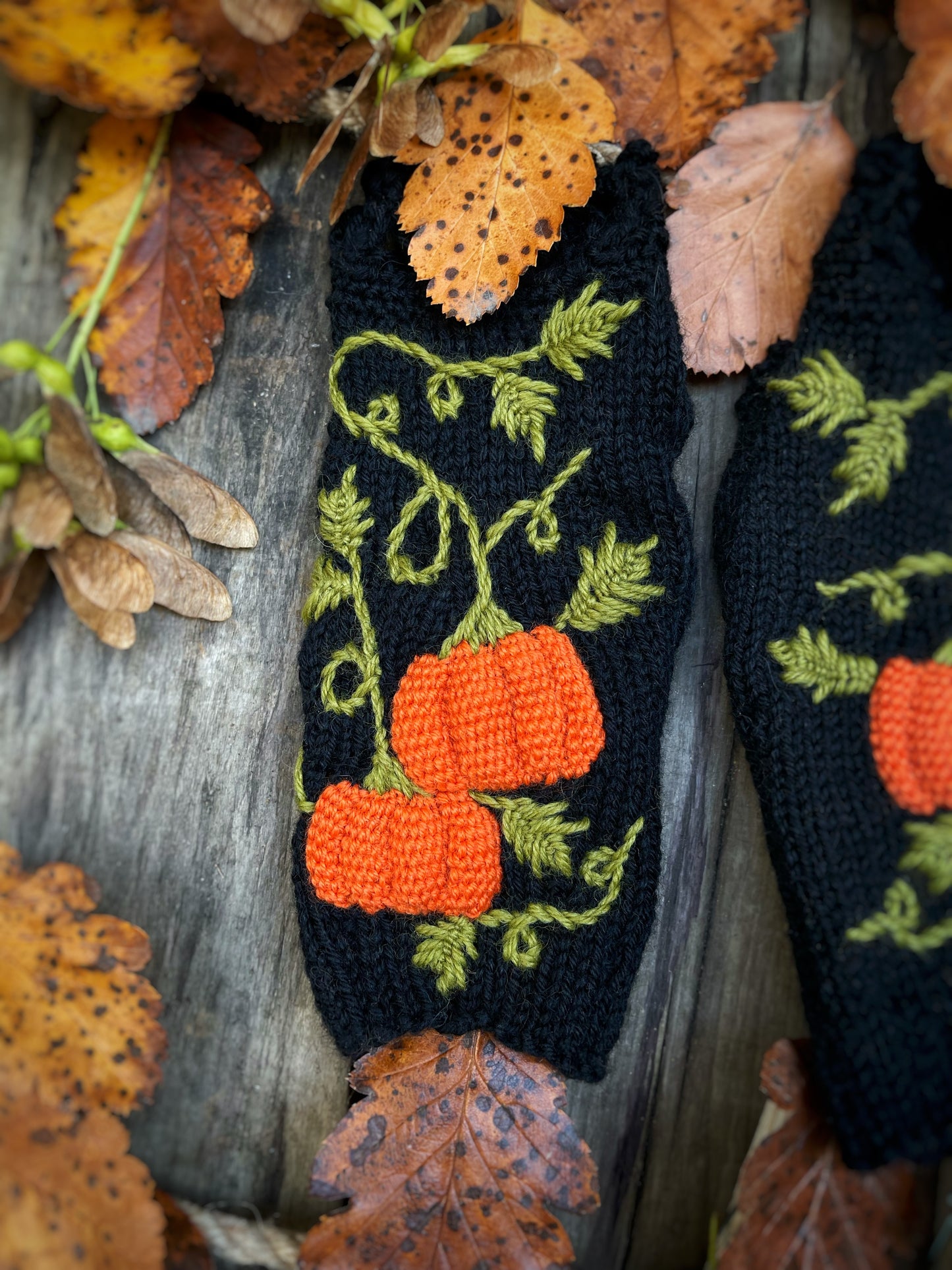 Black fingerless gloves with embroidered pumpkins