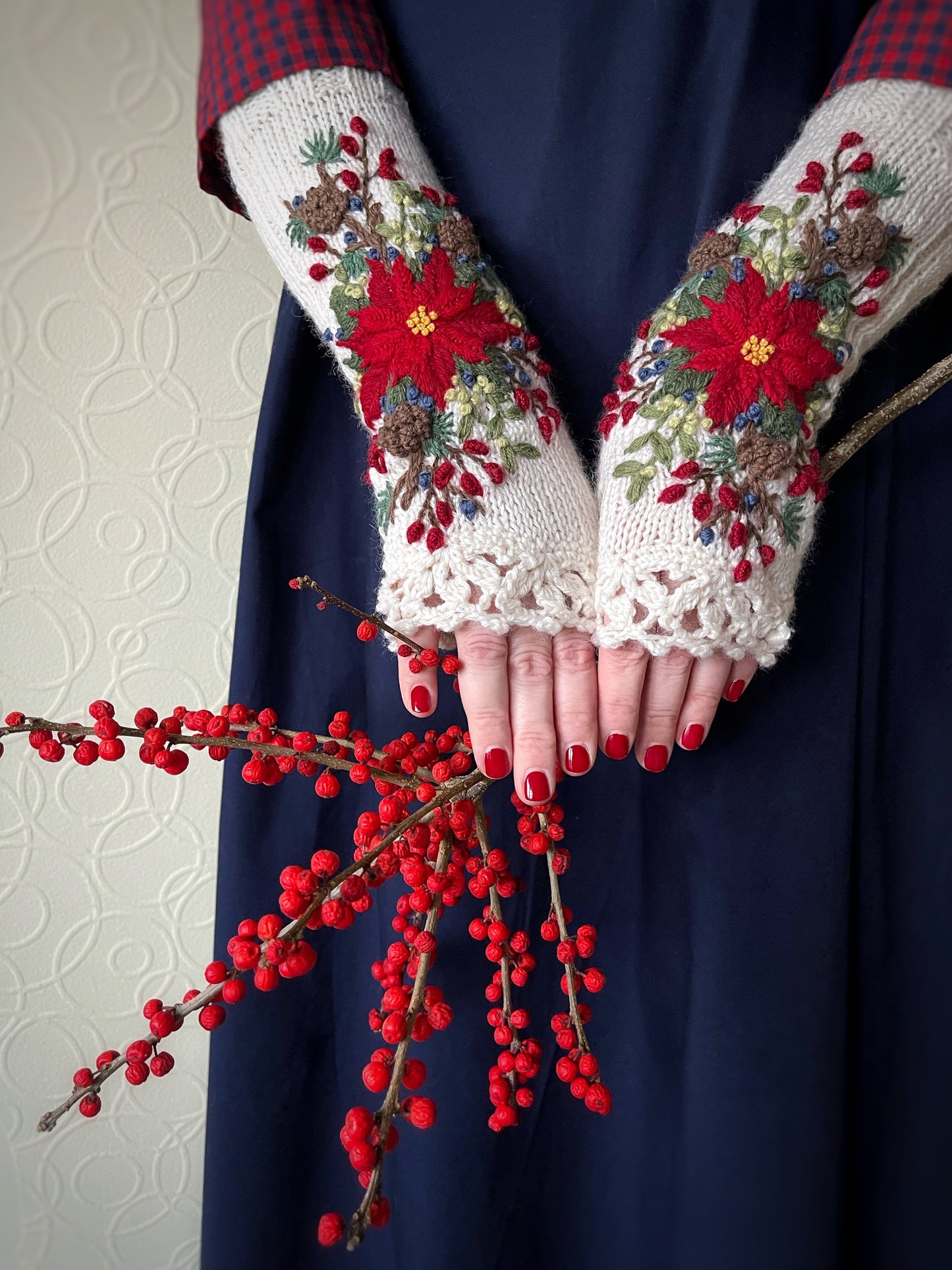 White embroidered gloves with poinsettia flowers, larch cones, rose hips and mistletoe