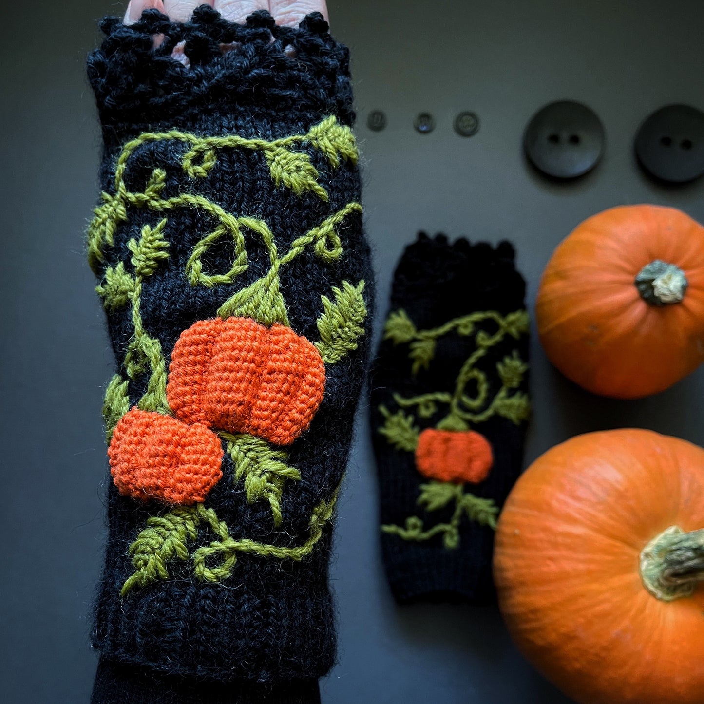 Black fingerless gloves with embroidered pumpkins