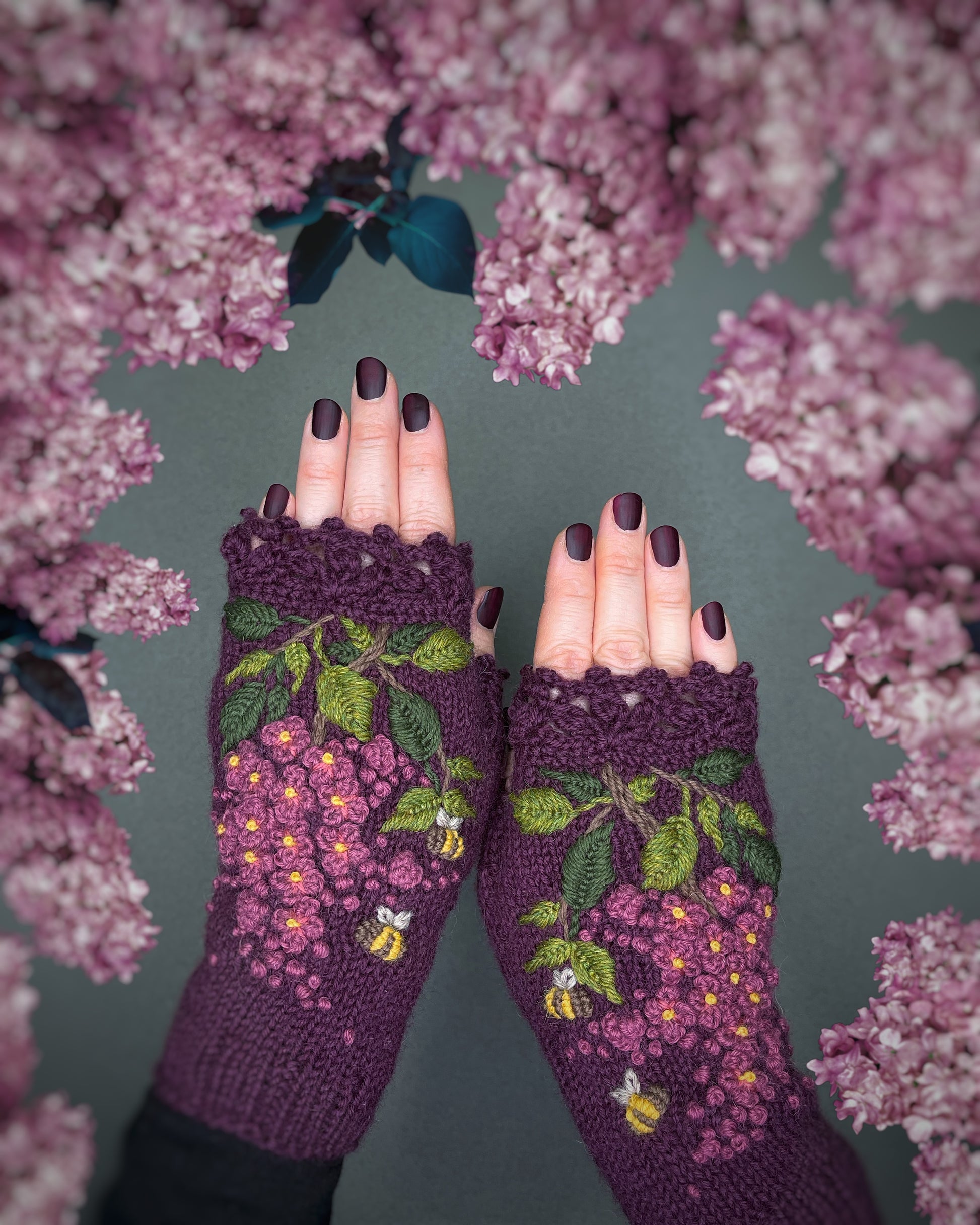 Lilacs and bees embroidered on knitted gloves