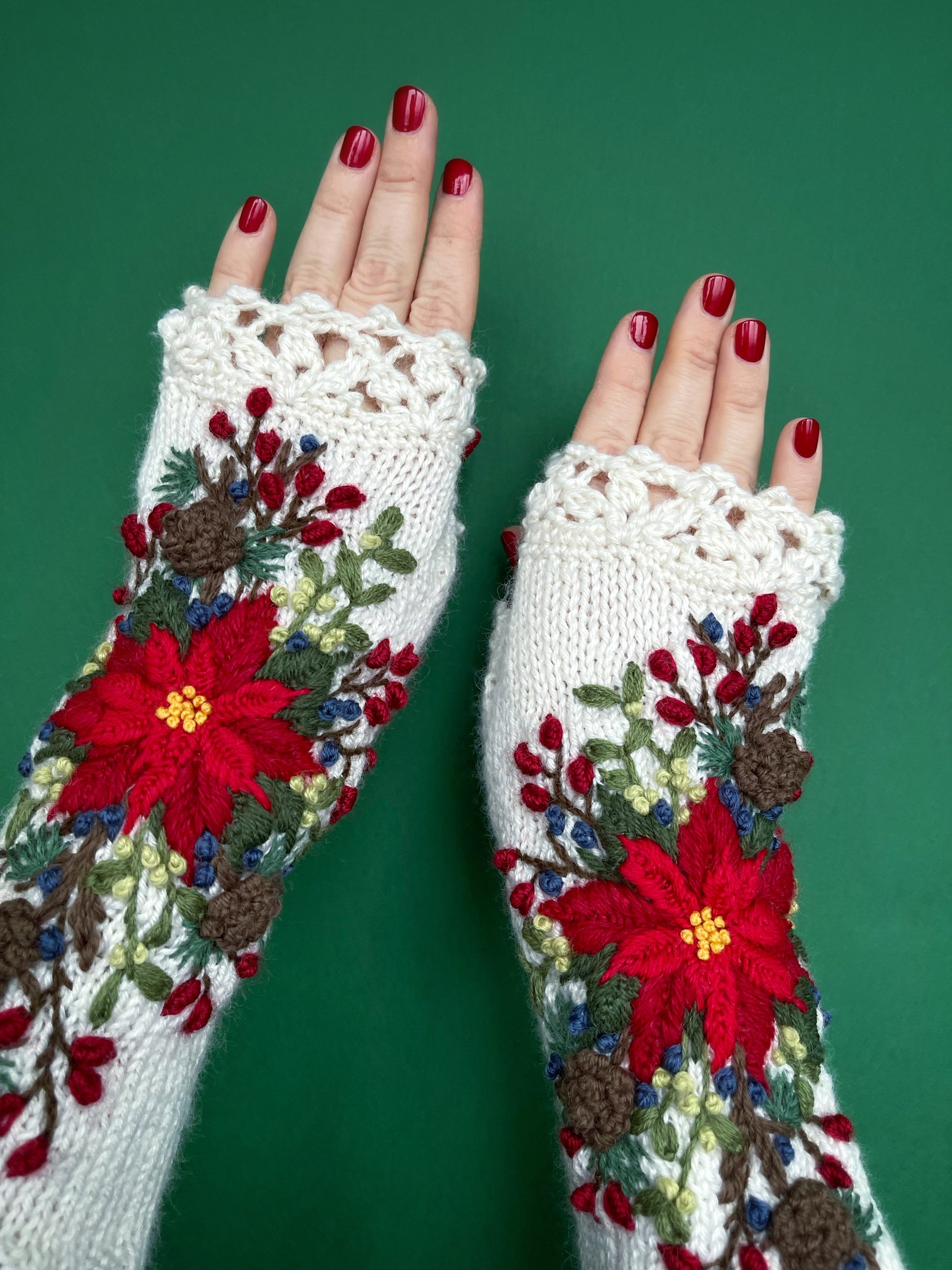 Long white gloves with poinsettia, larch cones, rose hips and mistletoe