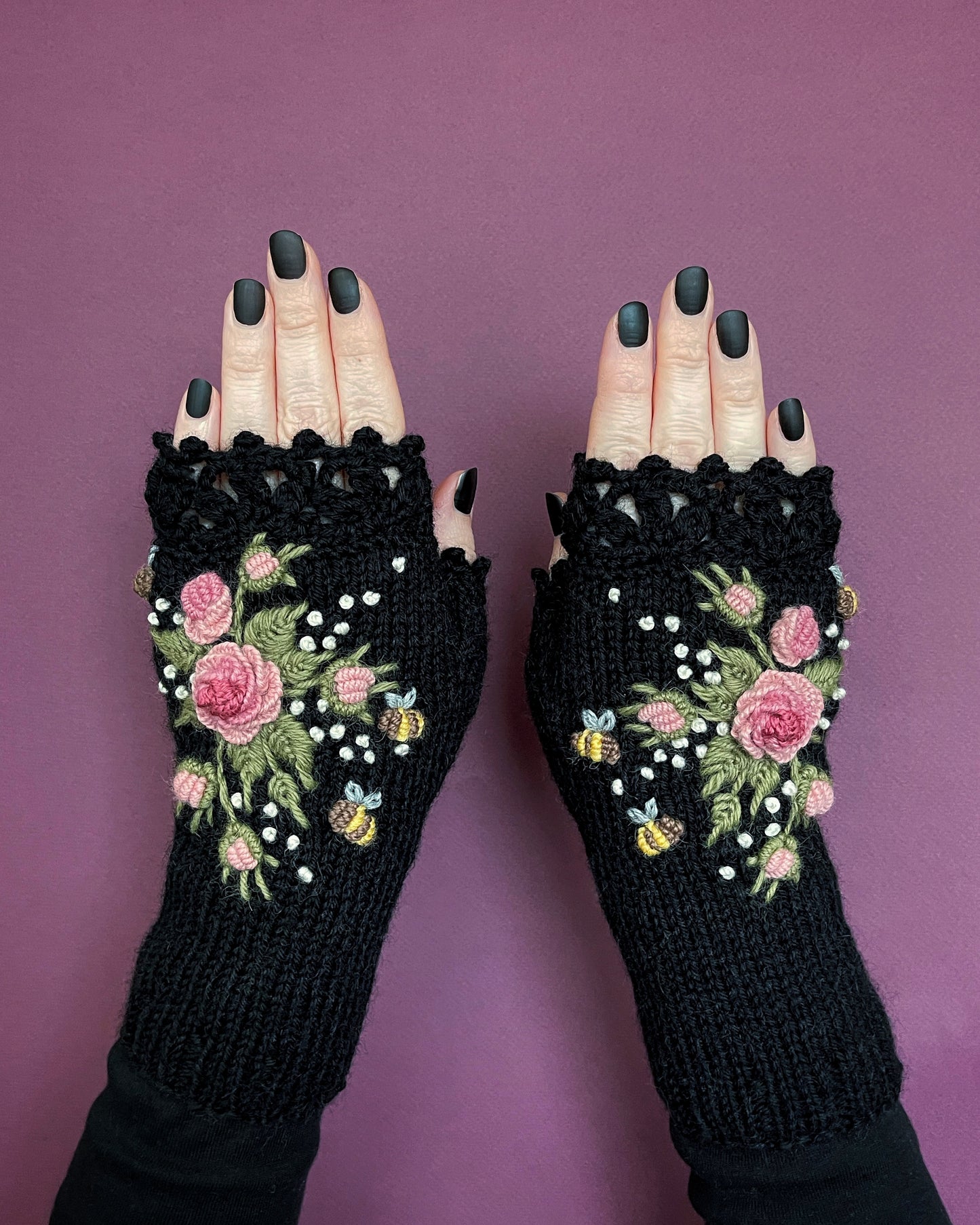 Black gloves with pink roses and bees